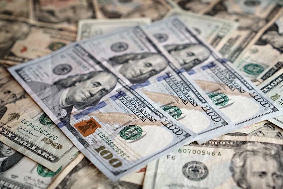 Stack of one hundred dollar bills representing direct cash purchase of business notes